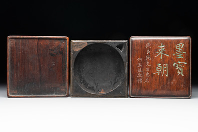 Two Chinese carved bamboo brush pots and an ink stone with wooden cover and stand, signed He Xuanting 何選廷 and Dian Liangbi 典良弼, 19th C.