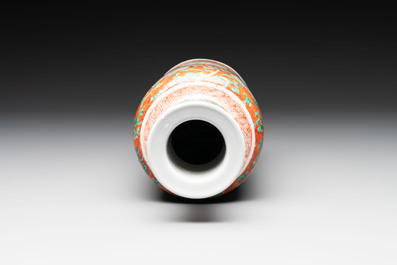 A Chinese famille verte coral-red-ground rouleau vase with flower scrolls, Kangxi