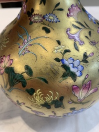 A Chinese gilt-ground famille rose vase with floral design, Qianlong mark and possibly of the period