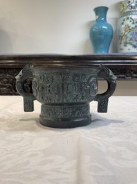 A Chinese bronze censer with Xuande mark and an archaistic vessel, 18/19th C.