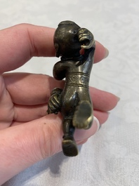 A Chinese bronze scroll weight in shape of two boys, Qing