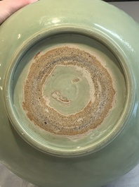 A Chinese Longquan celadon bowl with 'anhua' floral design, Ming