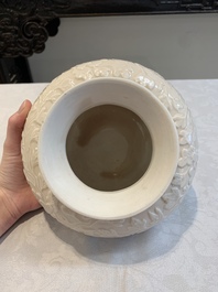 A rare Chinese Dehua blanc de Chine vase with floral design, Kangxi