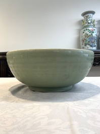 A Chinese Longquan celadon bowl with 'anhua' floral design, Ming
