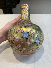 A Chinese gilt-ground famille rose vase with floral design, Qianlong mark and possibly of the period