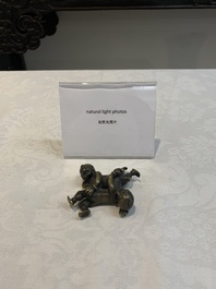 A Chinese bronze scroll weight in shape of two boys, Qing