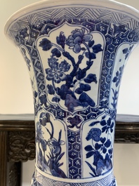 A Chinese blue and white 'gu' vase with floral design, Kangxi