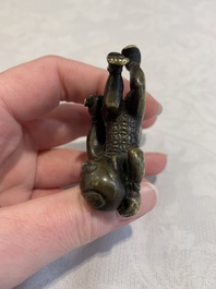 A Chinese bronze scroll weight in shape of two boys, Qing