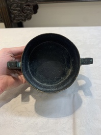A Chinese bronze censer with Xuande mark and an archaistic vessel, 18/19th C.