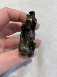 A Chinese bronze scroll weight in shape of two boys, Qing