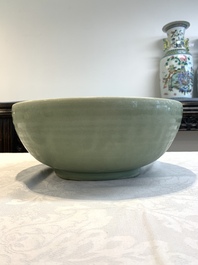 A Chinese Longquan celadon bowl with 'anhua' floral design, Ming