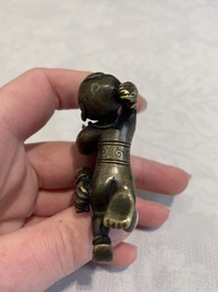 A Chinese bronze scroll weight in shape of two boys, Qing