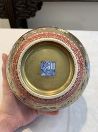 A Chinese gilt-ground famille rose vase with floral design, Qianlong mark and possibly of the period