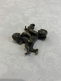 A Chinese bronze scroll weight in shape of two boys, Qing