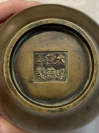 A Chinese bronze censer with Xuande mark and an archaistic vessel, 18/19th C.