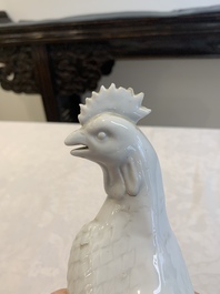 A pair of Chinese Dehua blanc de Chine models of roosters, 18th C.