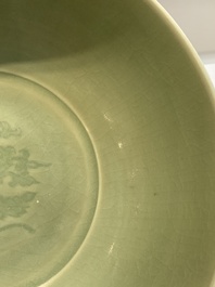A Chinese Longquan celadon bowl with 'anhua' floral design, Ming