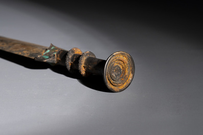 A rare Chinese turquoise-inlaid parcel-gilt bronze sword, Zhou