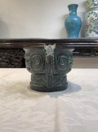 A Chinese bronze censer with Xuande mark and an archaistic vessel, 18/19th C.