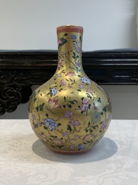 A Chinese gilt-ground famille rose vase with floral design, Qianlong mark and possibly of the period