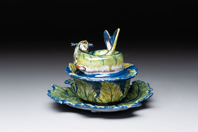 A rare polychrome Dutch Delft pike tureen and cover on stand, 18th C.