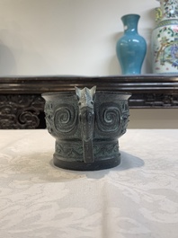 A Chinese bronze censer with Xuande mark and an archaistic vessel, 18/19th C.