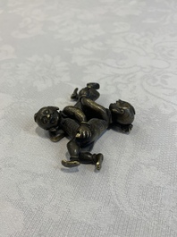 A Chinese bronze scroll weight in shape of two boys, Qing