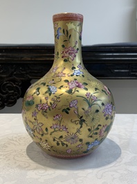 A Chinese gilt-ground famille rose vase with floral design, Qianlong mark and possibly of the period