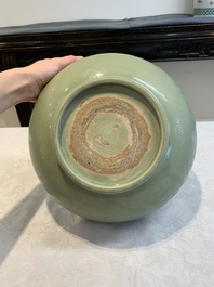 A Chinese Longquan celadon bowl with 'anhua' floral design, Ming