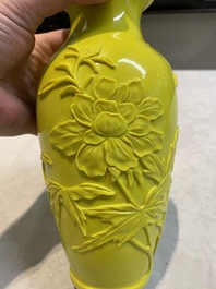 A pair of Chinese yellow Peking glass vases with peonies and a bird, 20th C.