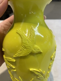 A pair of Chinese yellow Peking glass vases with peonies and a bird, 20th C.