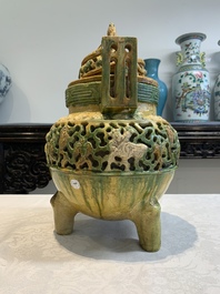 A Chinese sancai-glazed reticulated double-walled tripod censer and cover, Ming