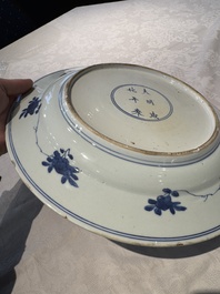 A pair of Chinese blue and white 'floral' dishes, Chenghua mark, Kangxi