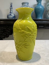 A pair of Chinese yellow Peking glass vases with peonies and a bird, 20th C.