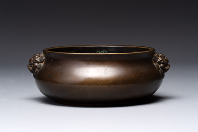 A Chinese bronze censer with lion-form handles, 大明宣德五年監造工部官監吳邦佐造 mark, 18th C.