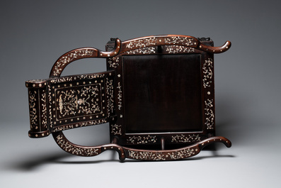 A Chinese mother-of-pearl-inlaid hongmu reclining armchair with a retractable footrest, Canton, 19th C.