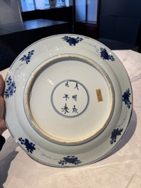 A pair of Chinese blue and white 'floral' dishes, Chenghua mark, Kangxi