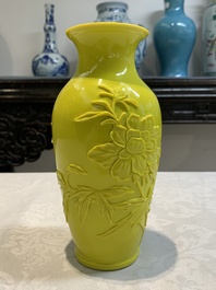 A pair of Chinese yellow Peking glass vases with peonies and a bird, 20th C.