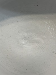A Chinese white-glazed incised 'double phoenix' dish, Jiajing mark and of the period