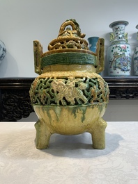 A Chinese sancai-glazed reticulated double-walled tripod censer and cover, Ming