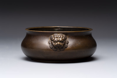 A Chinese bronze censer with lion-form handles, 大明宣德五年監造工部官監吳邦佐造 mark, 18th C.
