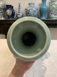 A pair of Chinese celadon-glazed vases with 'anhua' design on wooden stands, Qianlong mark, 19th C.