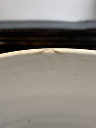 A Chinese white-glazed incised 'double phoenix' dish, Jiajing mark and of the period