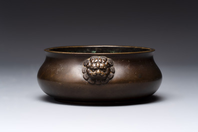 A Chinese bronze censer with lion-form handles, 大明宣德五年監造工部官監吳邦佐造 mark, 18th C.