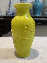 A pair of Chinese yellow Peking glass vases with peonies and a bird, 20th C.