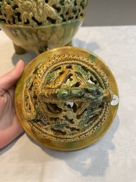 A Chinese sancai-glazed reticulated double-walled tripod censer and cover, Ming