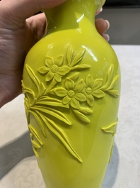 A pair of Chinese yellow Peking glass vases with peonies and a bird, 20th C.