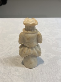 A carved alabaster figure of a seated bagpiper, Low Countries, possibly 17th C.