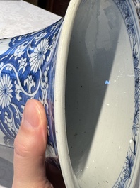 A pair of Chinese blue and white 'gu' vases with floral design, Kangxi
