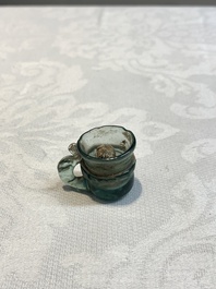 A Dutch or German green glass reliquary holder, excavated in Maastricht, 16/17th C.
